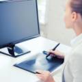businesswoman with drawing tablet in office